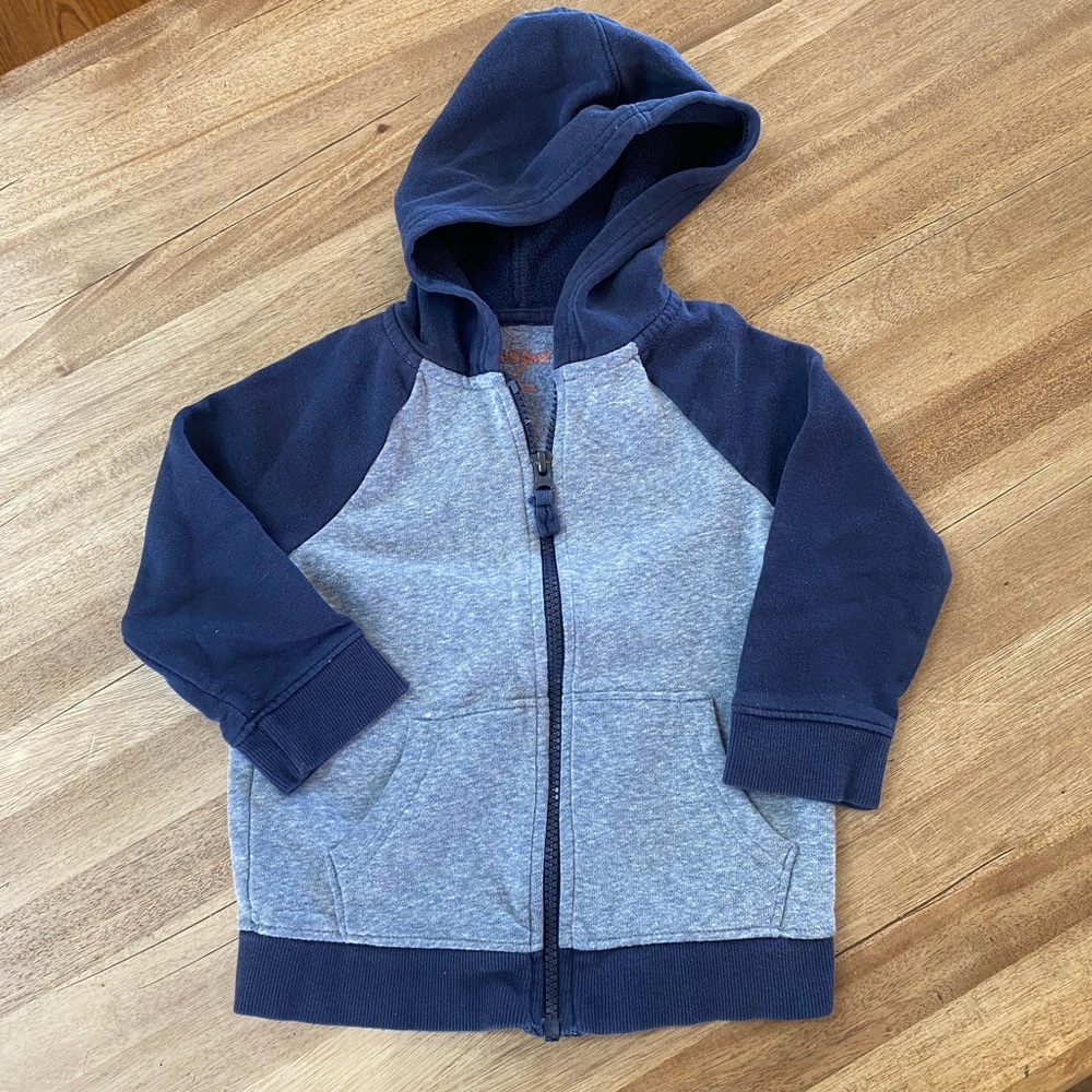 Grey zip up hoodie.